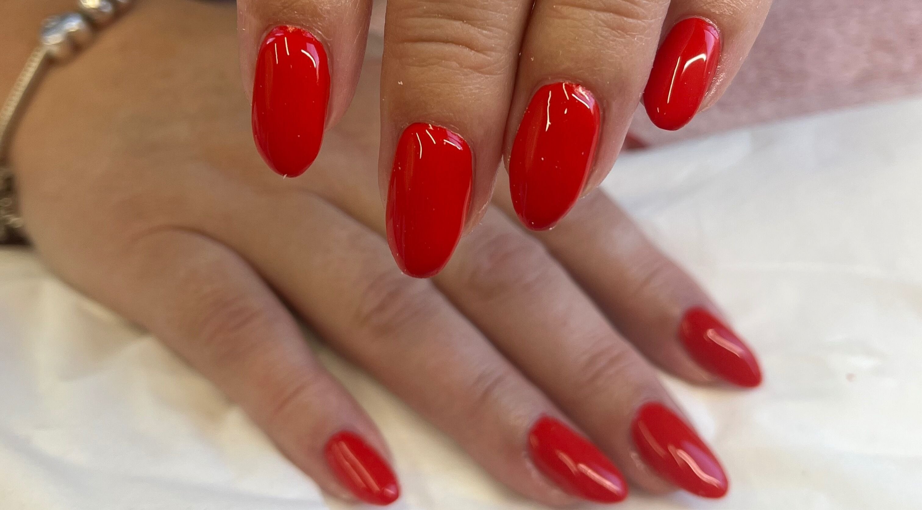 Vibrant red nail art at Magpie Nails, Havant, England, GB.