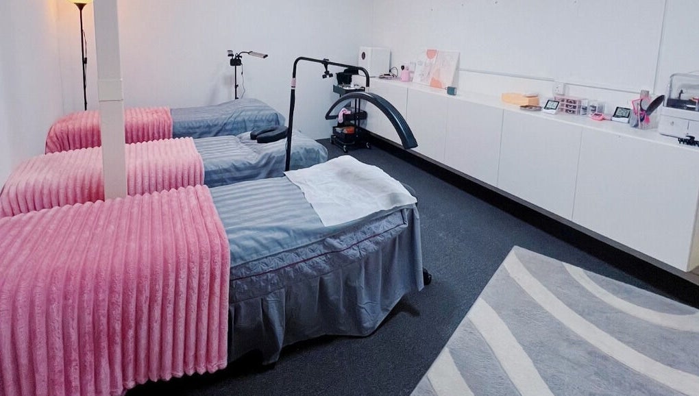 Luxury pampering beds at The Bae Dazzle in Johor Bahru, Johor, MY, featuring pink and grey decor.
