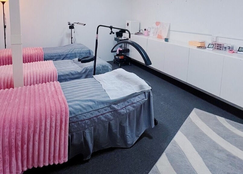 Luxury pampering beds at The Bae Dazzle in Johor Bahru, Johor, MY, featuring pink and grey decor.