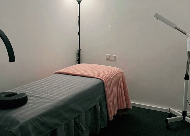 Relaxing massage room at The Bae Dazzle, Johor Bahru, Johor, MY with a soft pink blanket.