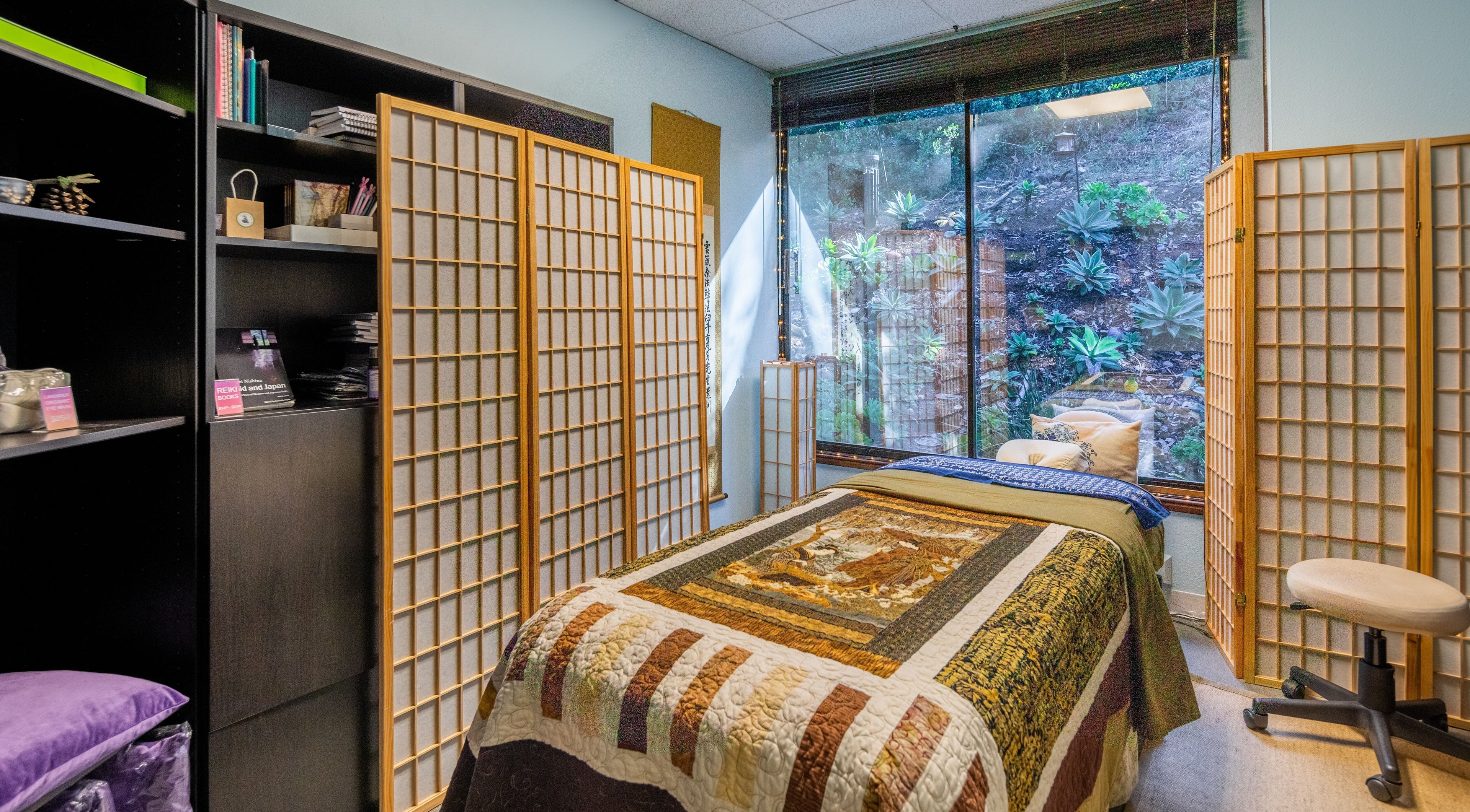 Relaxing treatment room at San Diego Reiki (Mission Valley), San Diego, CA, US with natural decor and large window view.