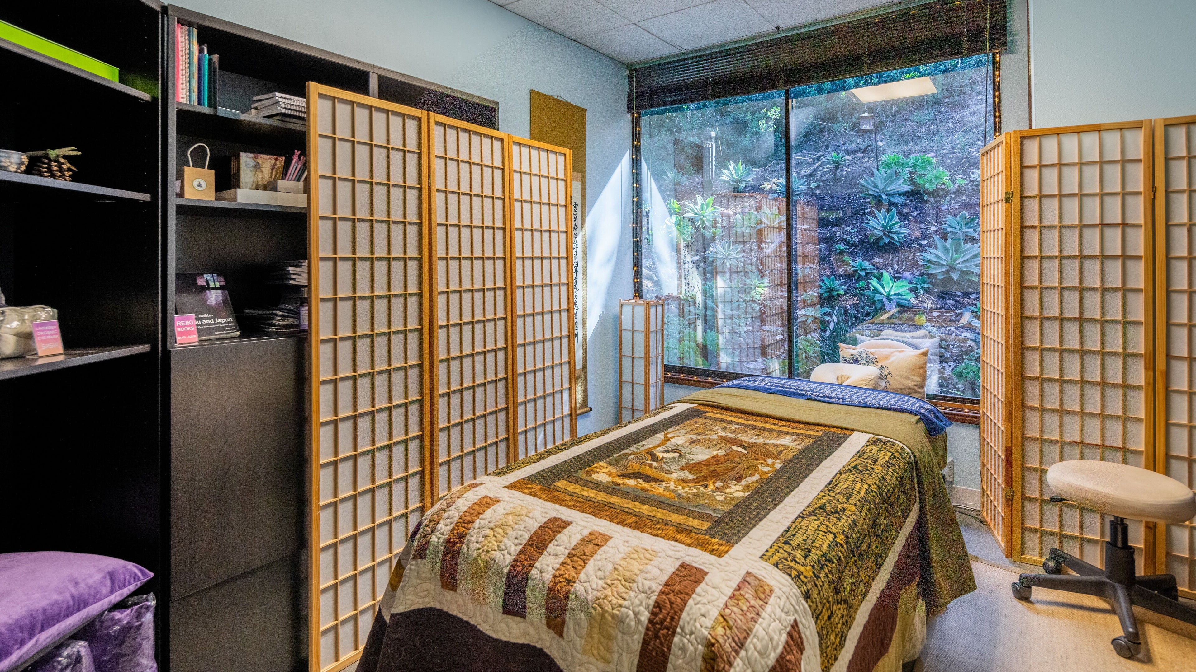 Relaxing treatment room at San Diego Reiki (Mission Valley), San Diego, CA, US with natural decor and large window view.