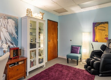 Cozy wellness room at San Diego Reiki (Mission Valley), San Diego, CA, with massage chair and calming decor.