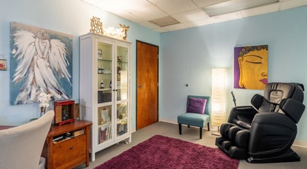 Cozy wellness room at San Diego Reiki (Mission Valley), San Diego, CA, with massage chair and calming decor.
