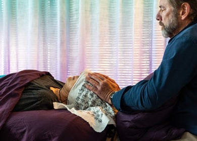 Therapist performing Reiki at San Diego Reiki (Mission Valley), San Diego, CA, US. Energy healing session underway.