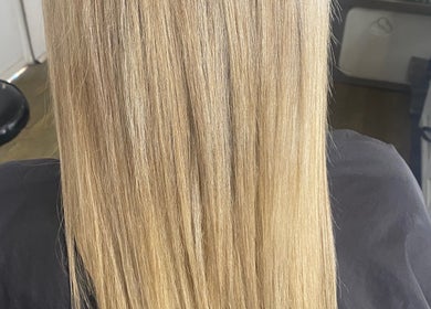 Smooth blonde hair at Jax Organic Hair & Makeup in Parmelia, Western Australia, AU. Experience salon-perfect shine.