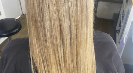 Smooth blonde hair at Jax Organic Hair & Makeup in Parmelia, Western Australia, AU. Experience salon-perfect shine.
