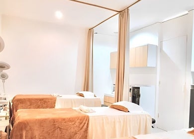 Relaxing treatment beds at ULU Beauty Studio in Bali, Bali, ID, offering a tranquil spa experience.