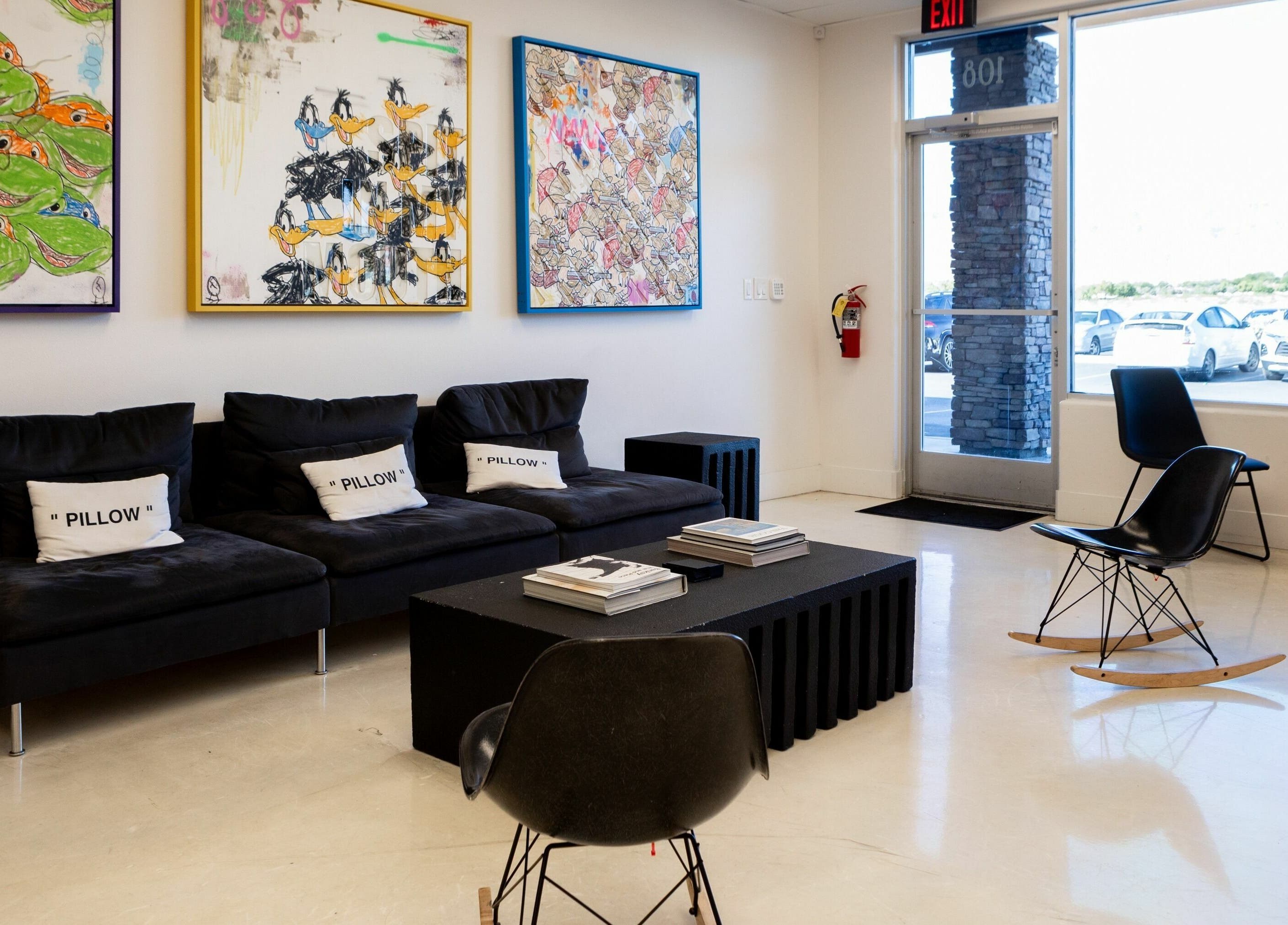 Cozy lounge with vibrant art at Lxve Studios, Las Vegas, Nevada, US, showcasing modern decor.