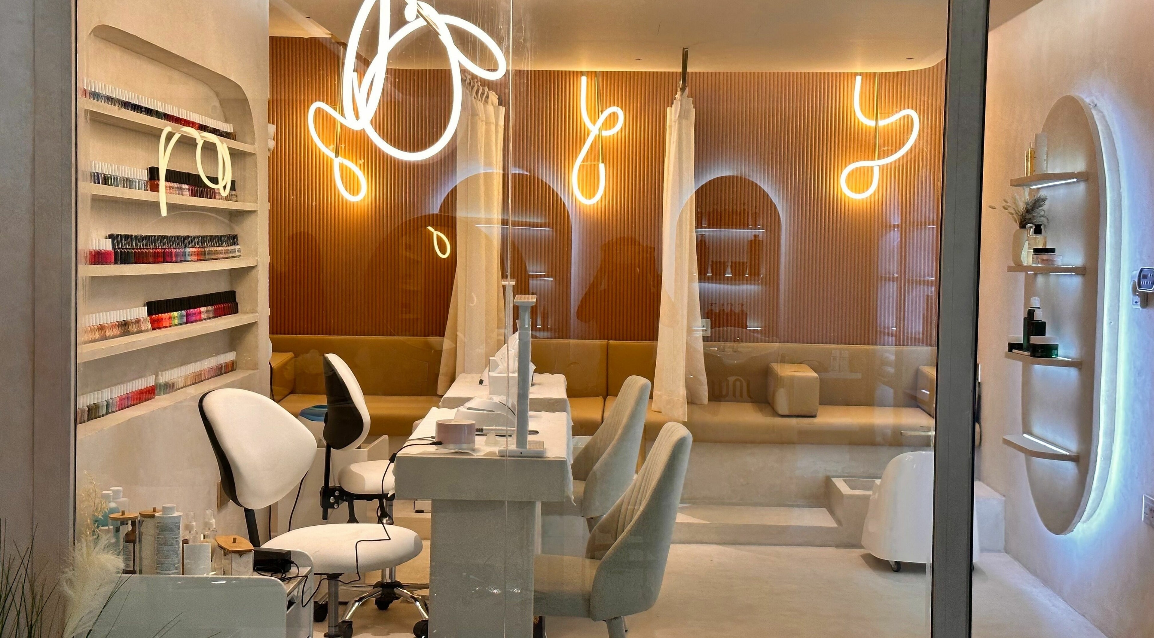 Chic interior of Jaw Beauty Salon in Abu Dhabi, AE featuring modern seating and a well-lit ambiance.