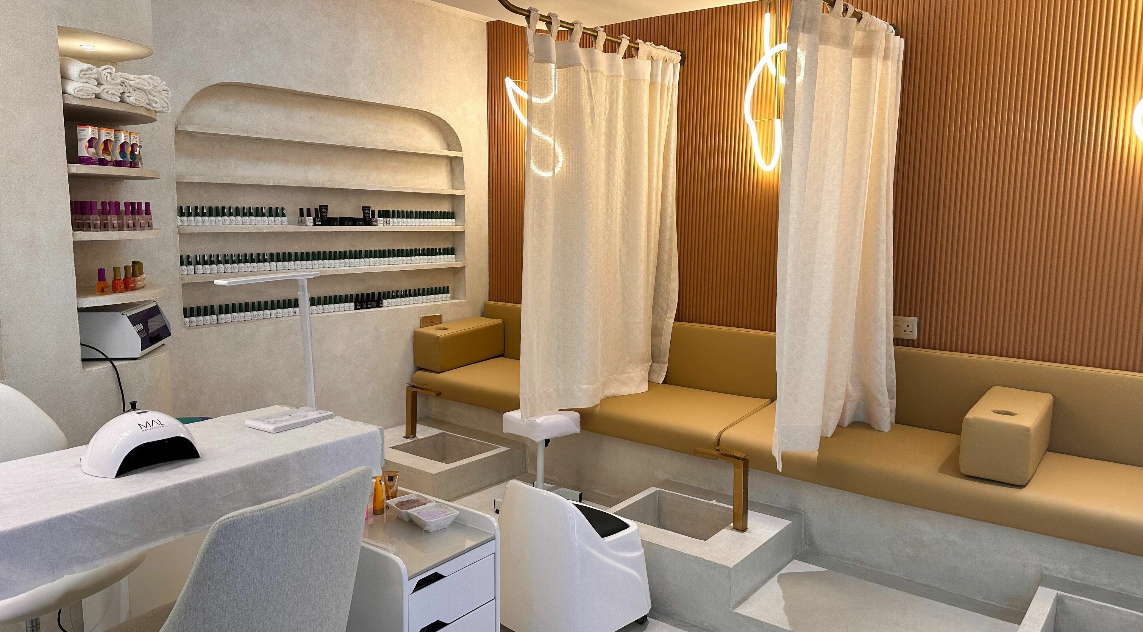 Elegant nail treatment area at Jaw Beauty Salon in Abu Dhabi, AE featuring luxurious seating and modern decor.