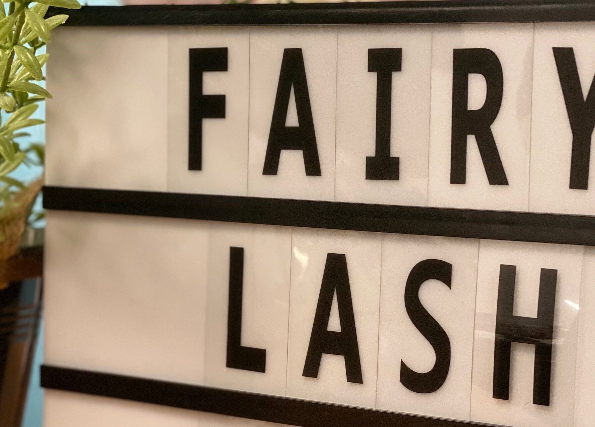 Fairy Lash KL sign with greenery in Kuala Lumpur, Wilayah Persekutuan Kuala Lumpur, MY.