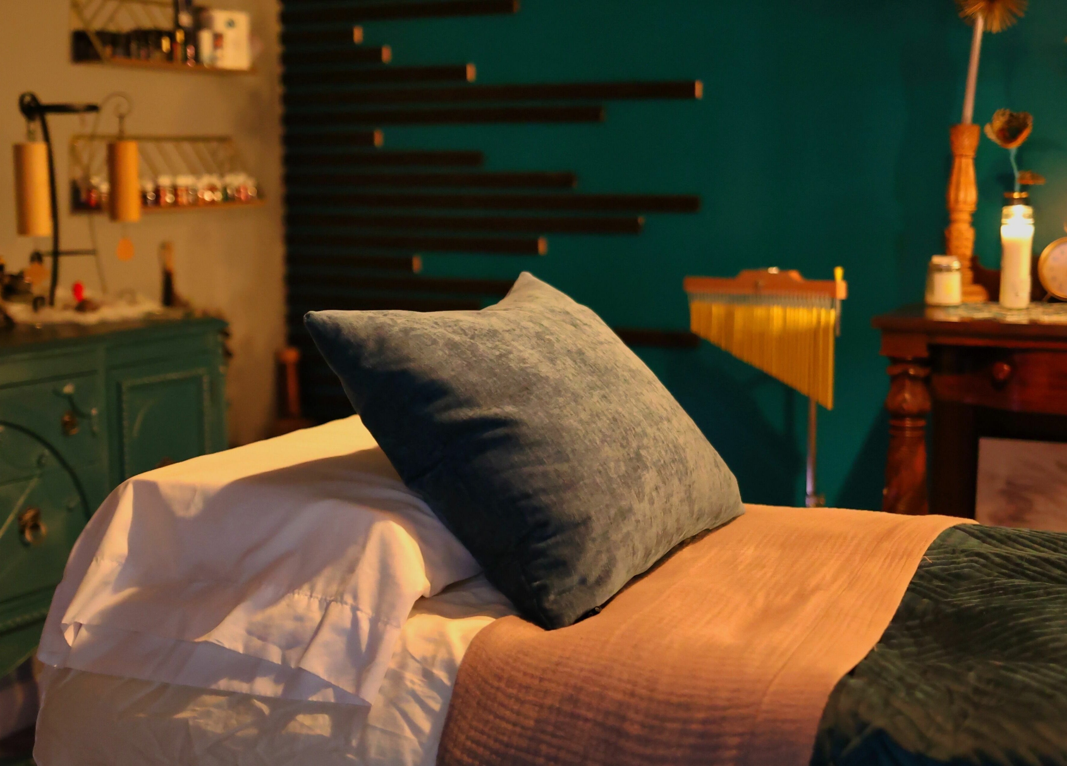 Cozy massage room at Aura Holistic and Metaphysical Wellness in Aurora, Illinois, US, with peaceful decor.