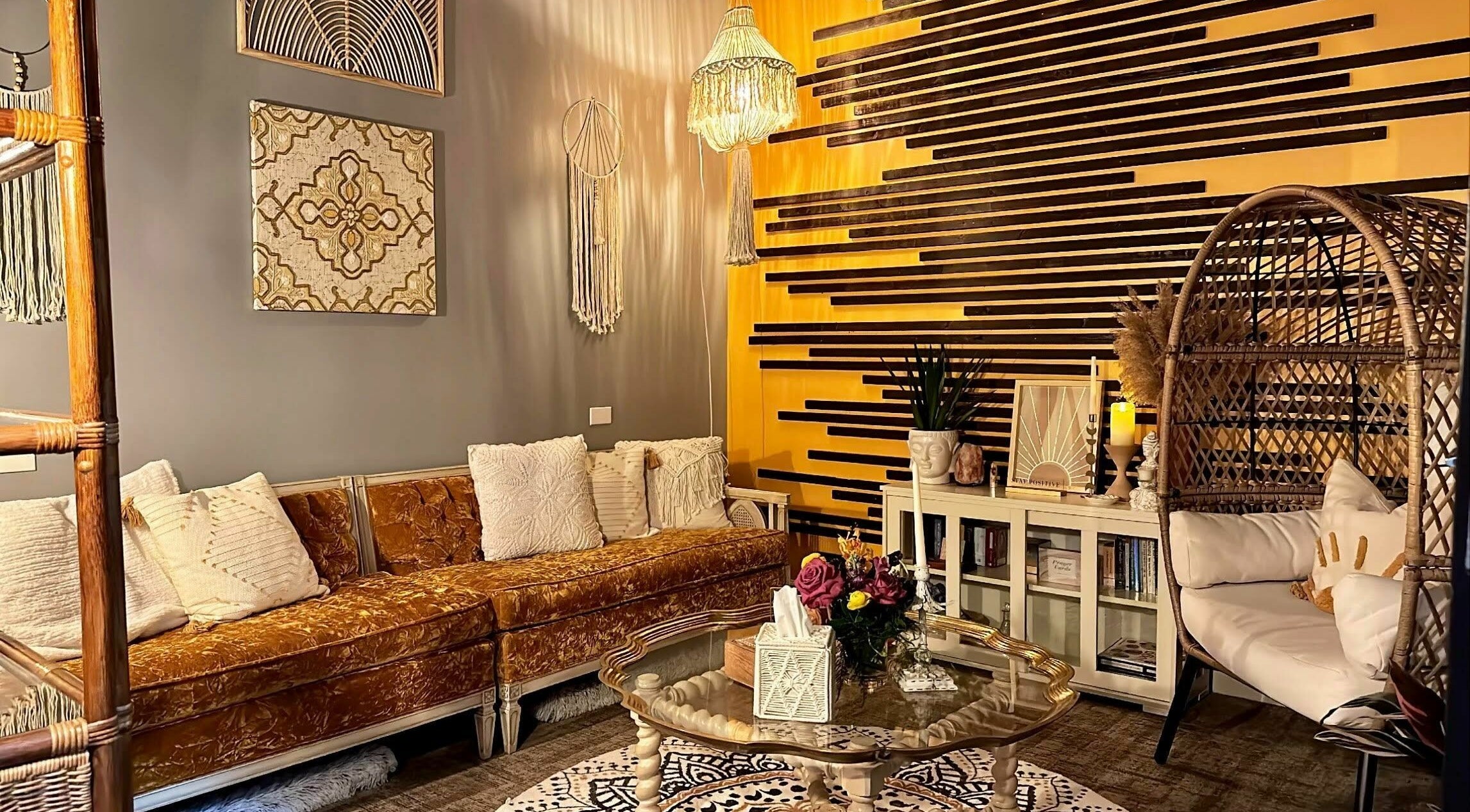 Cozy bohemian-style seating area at Aura Holistic and Metaphysical Wellness in Aurora, Illinois, US.