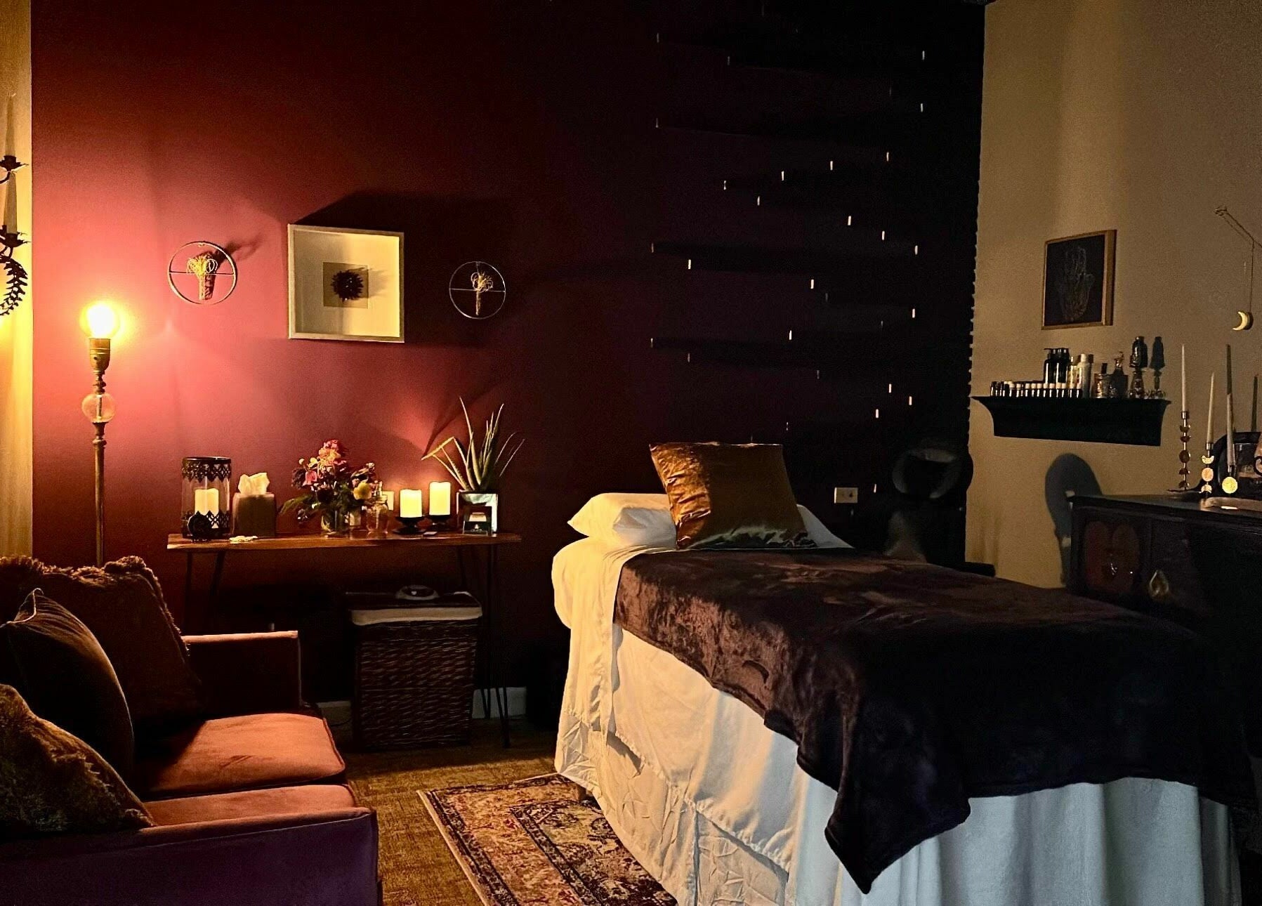 Cozy, dimly-lit treatment room at Aura Holistic and Metaphysical Wellness, Aurora, Illinois, US.