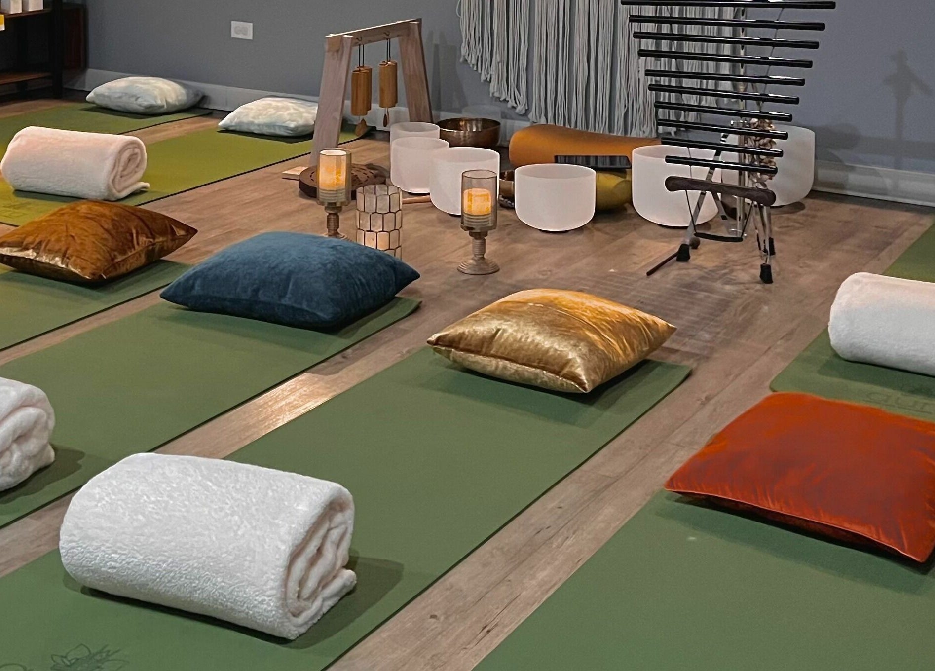 Relaxing meditation space at Aura Holistic and Metaphysical Wellness in Aurora, Illinois, US with mats and cushions.