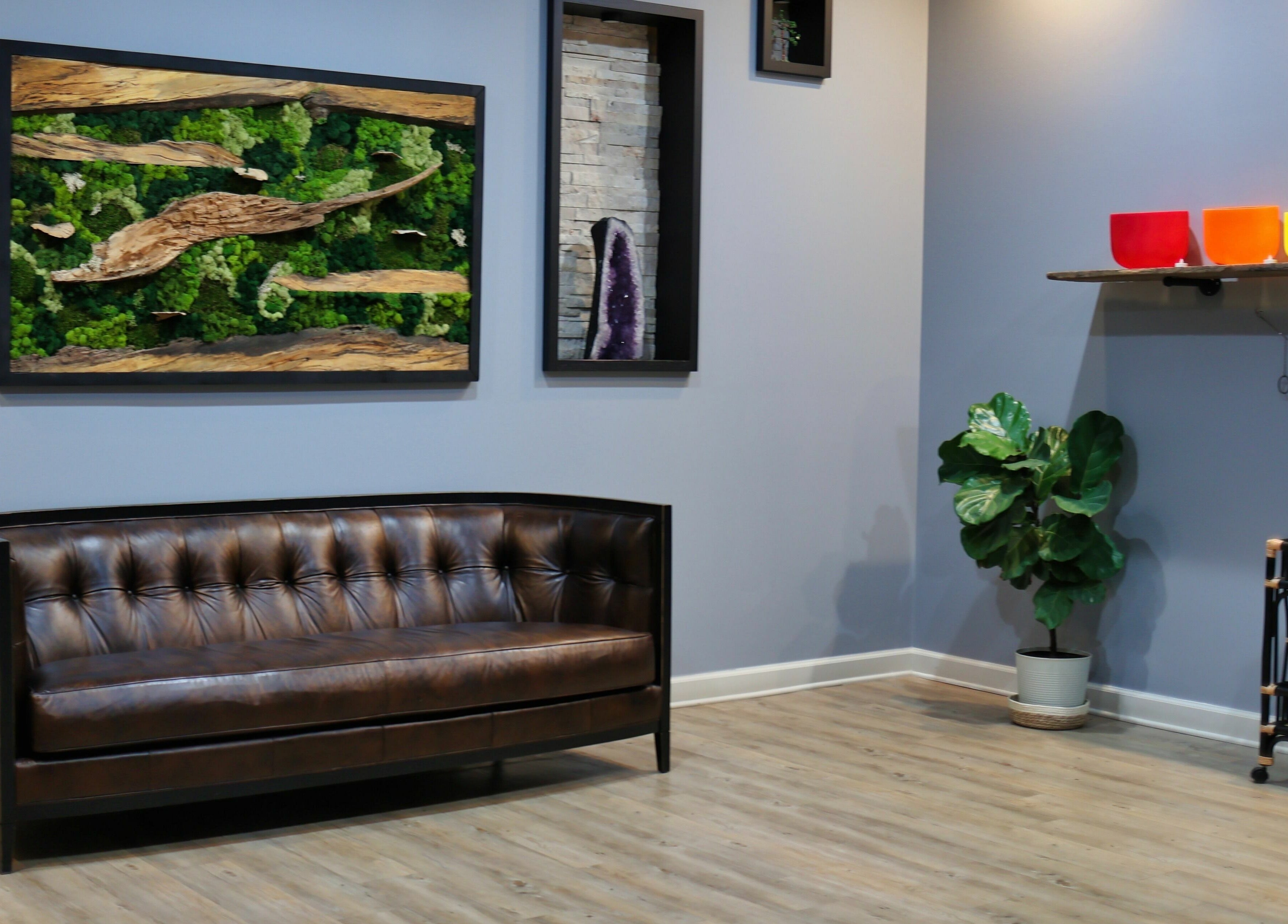 Cozy seating at Aura Holistic and Metaphysical Wellness, Aurora, Illinois, US, with decor and vibrant bowls.