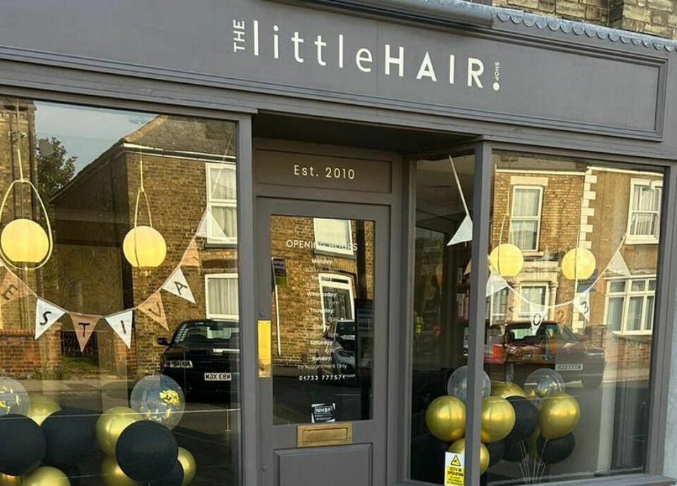 Front view of The Little Hair Shop in Whittlesey, England, GB with elegant decor and welcoming signage.