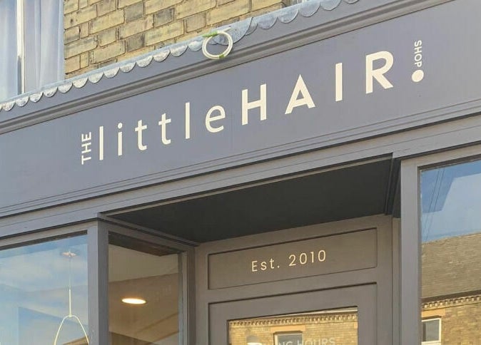 Modern facade of The Little Hair Shop in Whittlesey, England, GB, showcasing stylish exterior design.