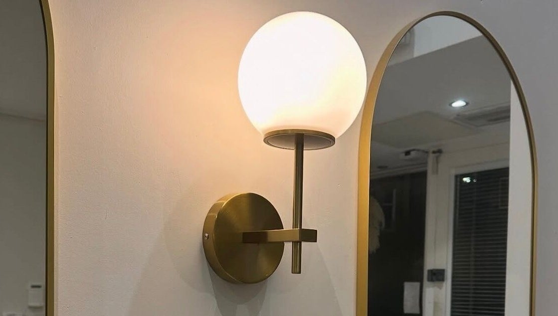 Elegant wall sconce at Chapter Twenty One, Edinburgh, Scotland, GB highlights modern design elements.