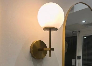 Elegant wall sconce at Chapter Twenty One, Edinburgh, Scotland, GB highlights modern design elements.