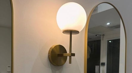 Elegant wall sconce at Chapter Twenty One, Edinburgh, Scotland, GB highlights modern design elements.