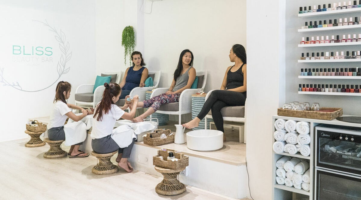 Women enjoying pedicures at Bliss Bar Yangon, a beauty venue in Yangon, Yangon Region, MM.