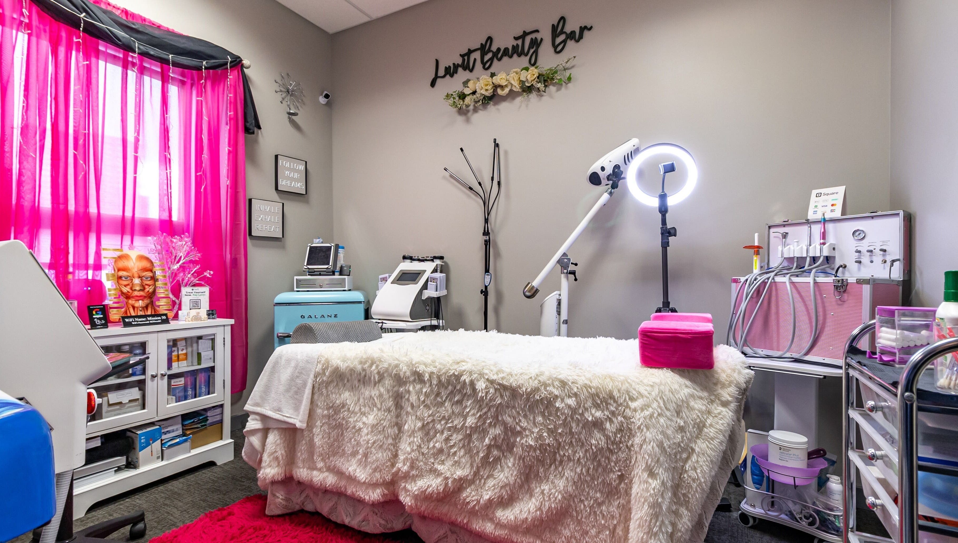 Cozy treatment room at Luvit Beauty Bar, Hoboken, New Jersey, US, with modern equipment and decor.