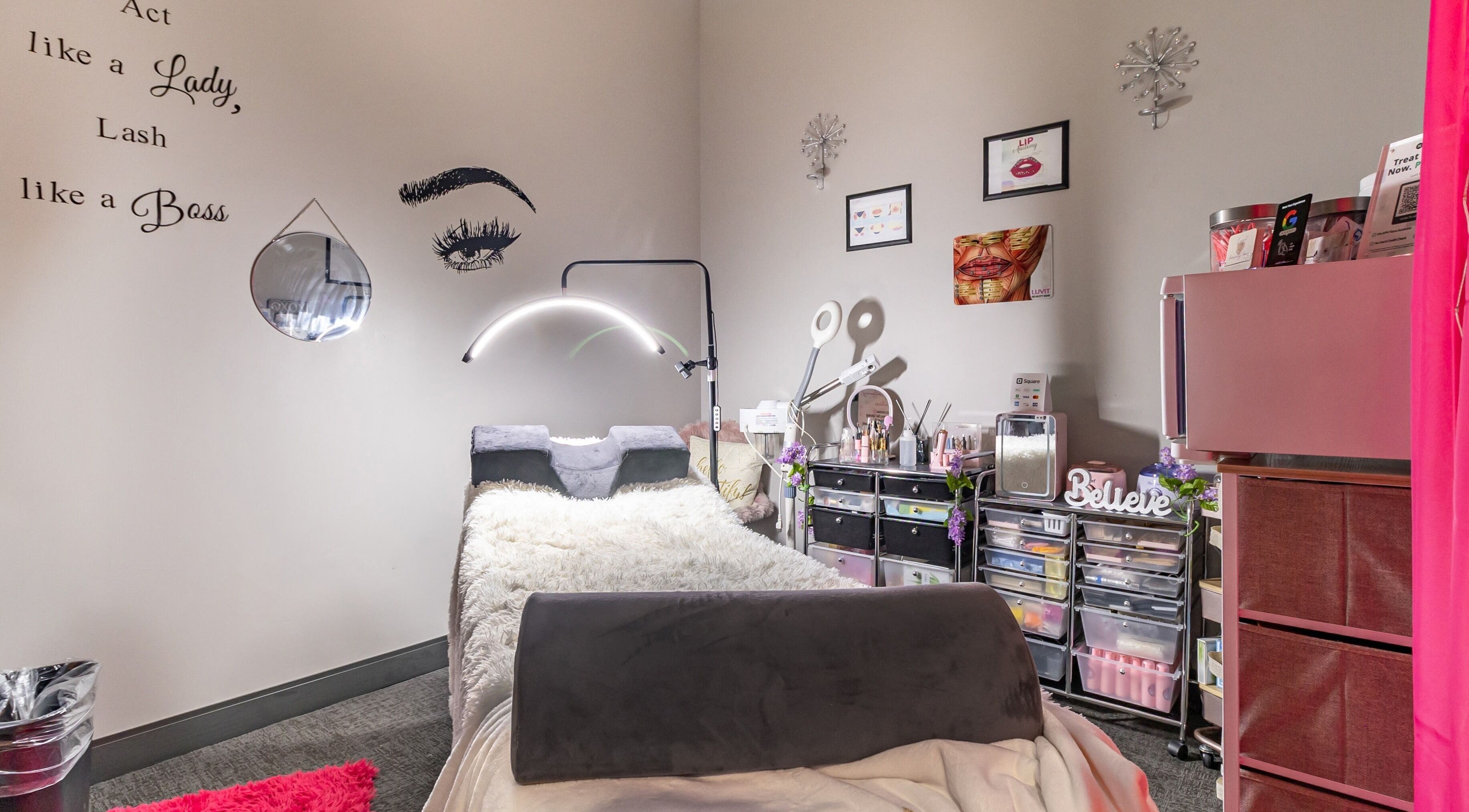 Cozy lash room at Luvit Beauty Bar in Hoboken, New Jersey, US with plush bed and elegant decor.