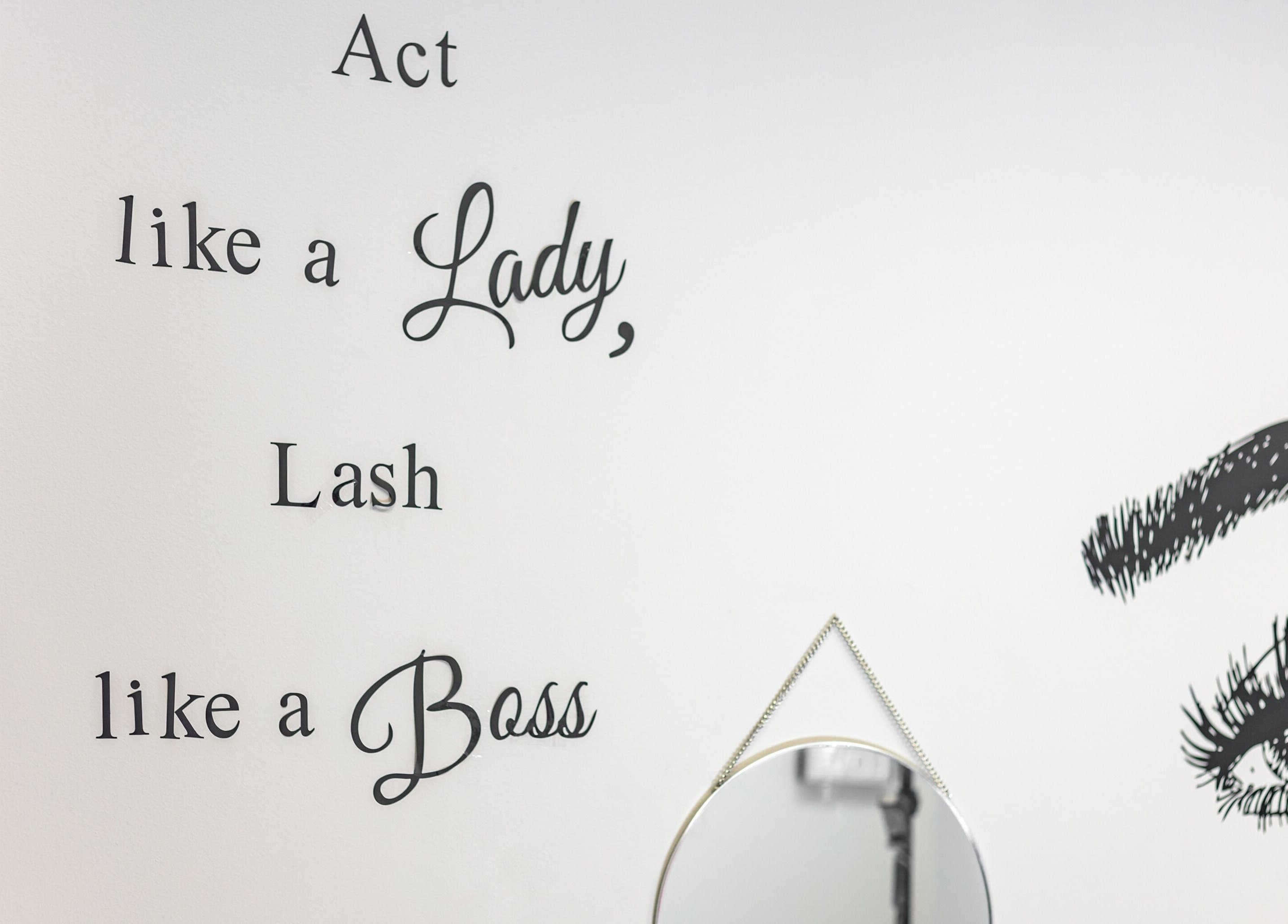Stylish wall art with lash quote at Luvit Beauty Bar, Hoboken, New Jersey, US captures elegant ambiance.