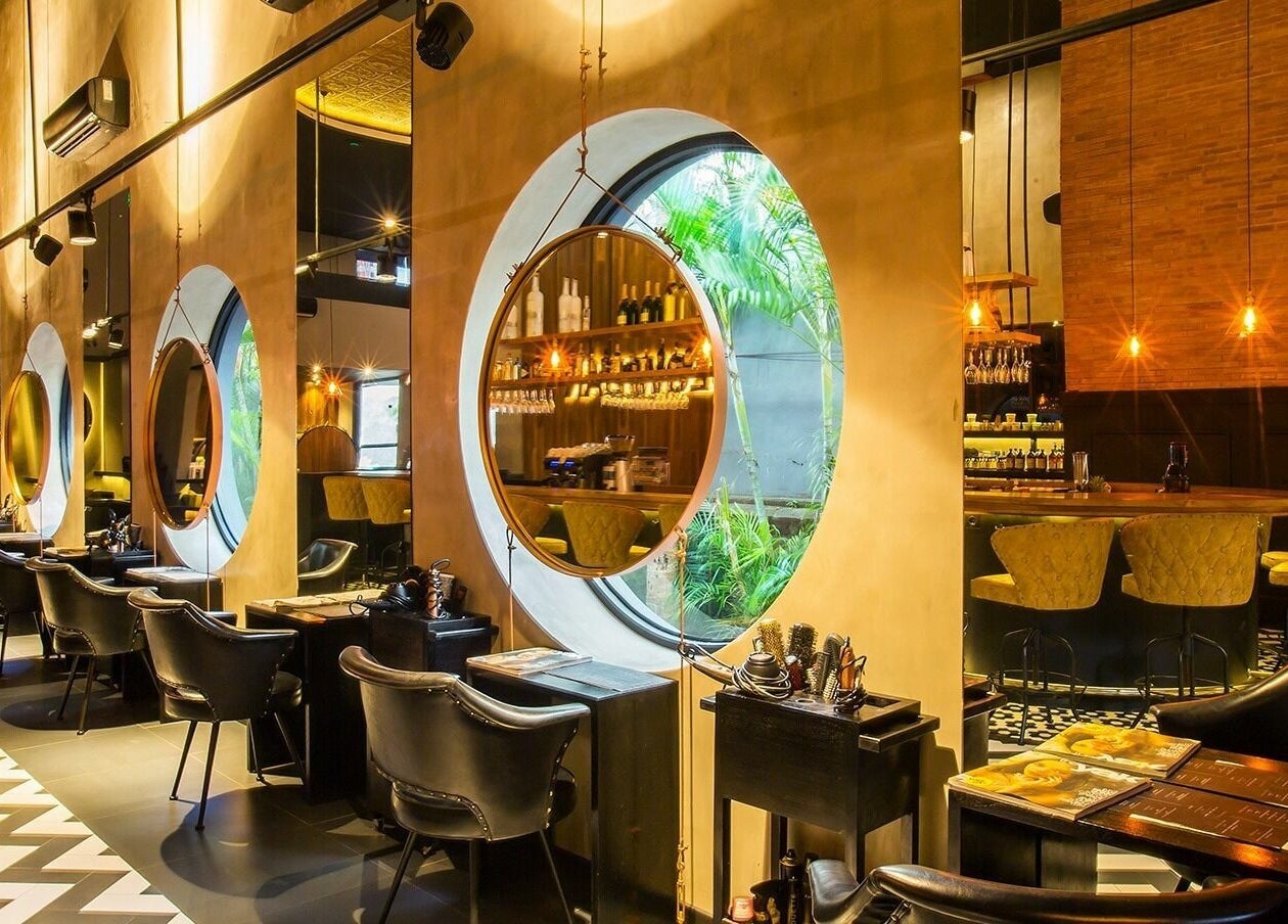 Elegant Blow Bar Bali salon interior in Bali, Bali, ID with chic mirrors and stylish seating arrangement.