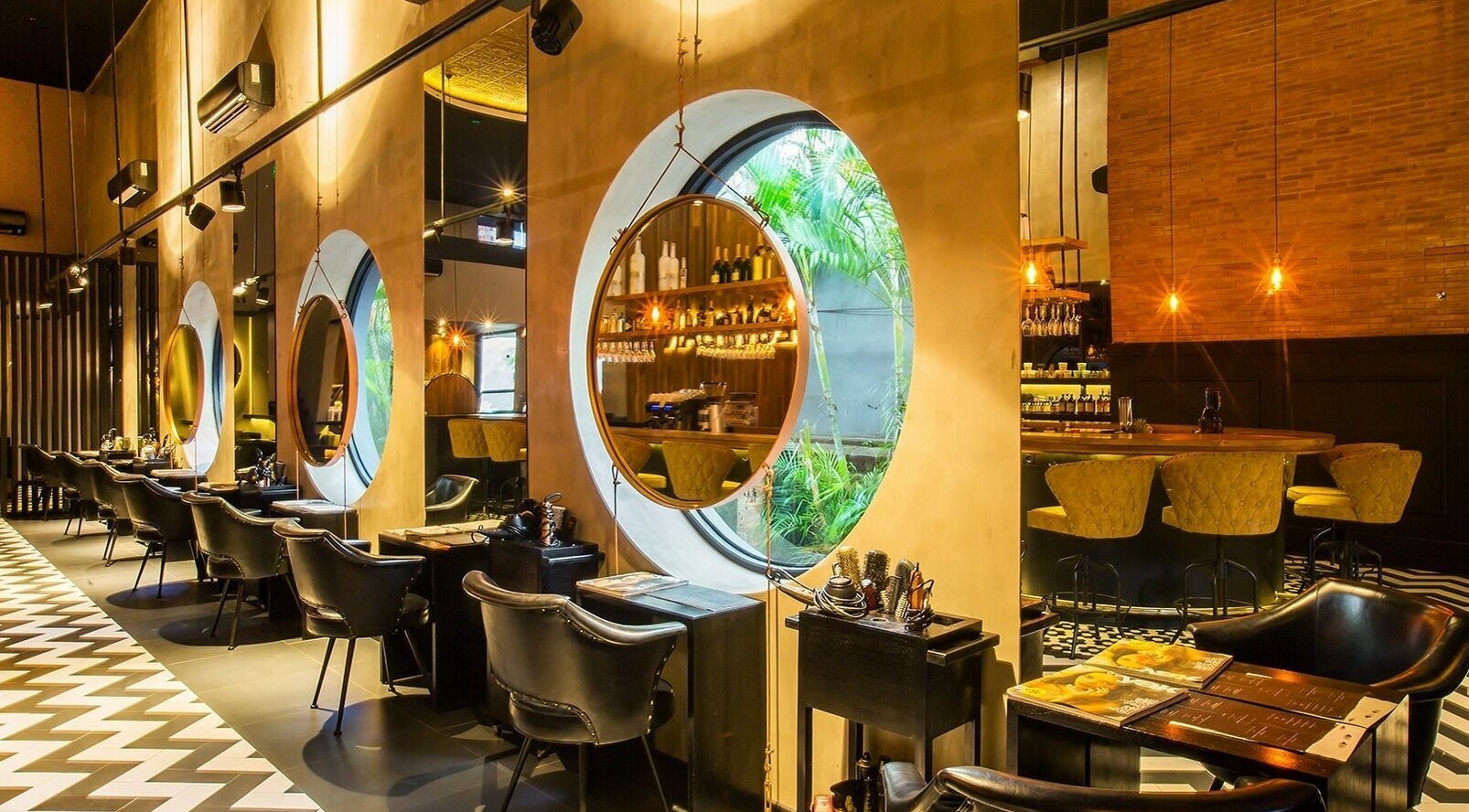 Elegant Blow Bar Bali salon interior in Bali, Bali, ID with chic mirrors and stylish seating arrangement.