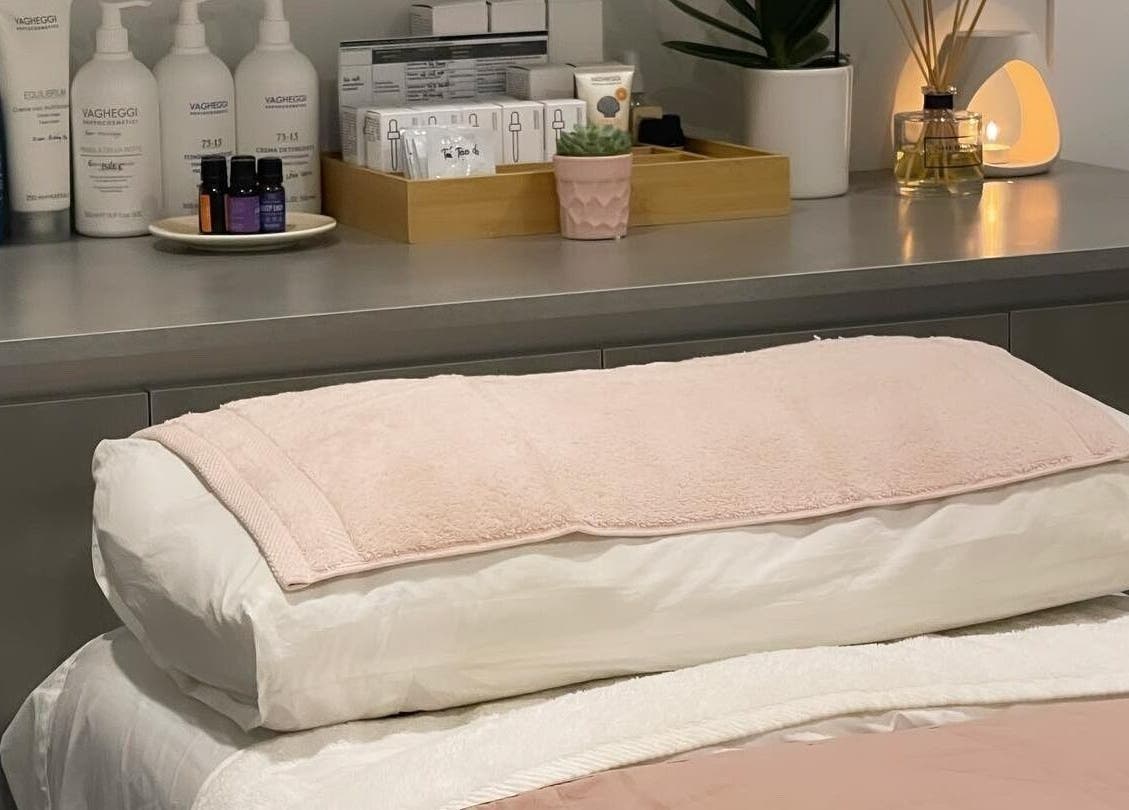 Tranquil treatment room in Diamond Day Spa, Lower Hutt, Wellington, NZ, featuring skincare products and soft towels.