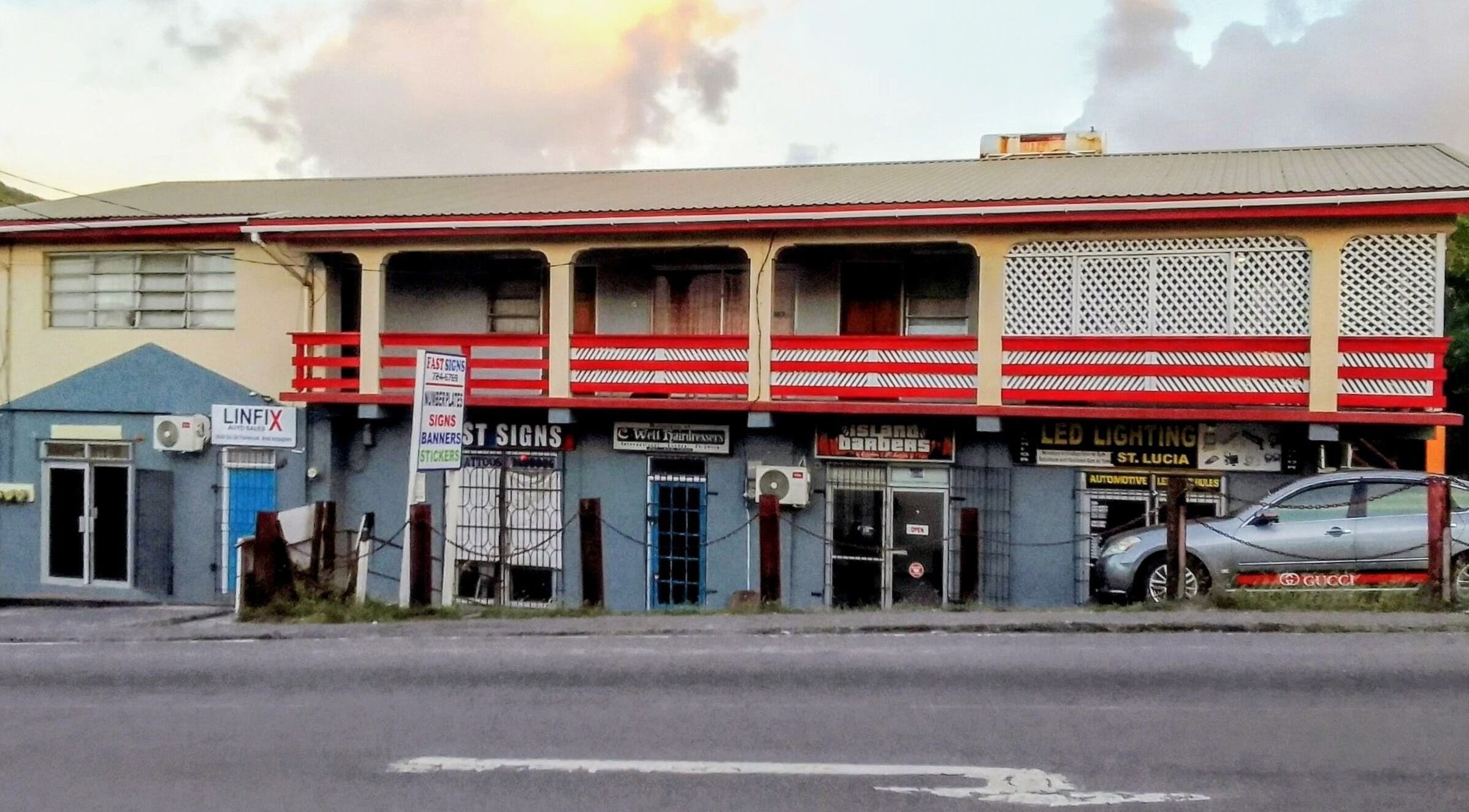 Bright facade of The StLucian Goddess Nail Salon, Gros Islet, LC, with colorful signage.