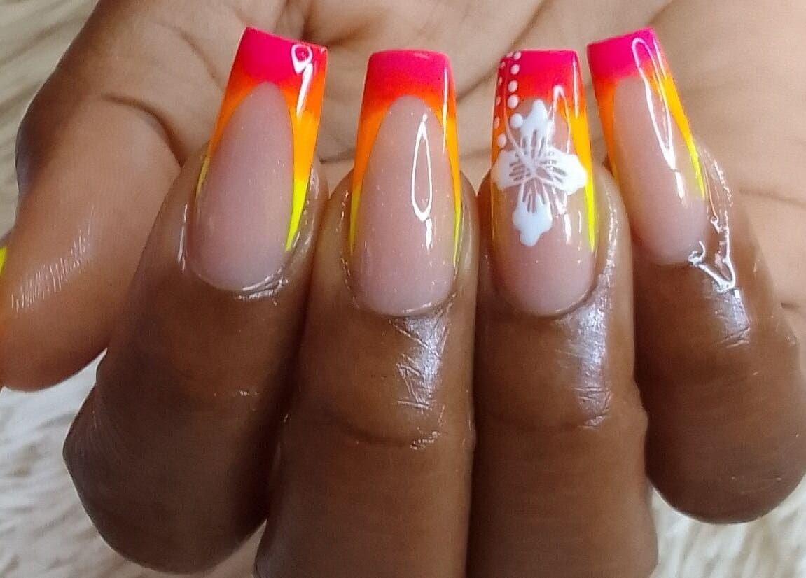 Vibrant tropical-themed nail art at The StLucian Goddess Nail Salon in Gros Islet, LC.