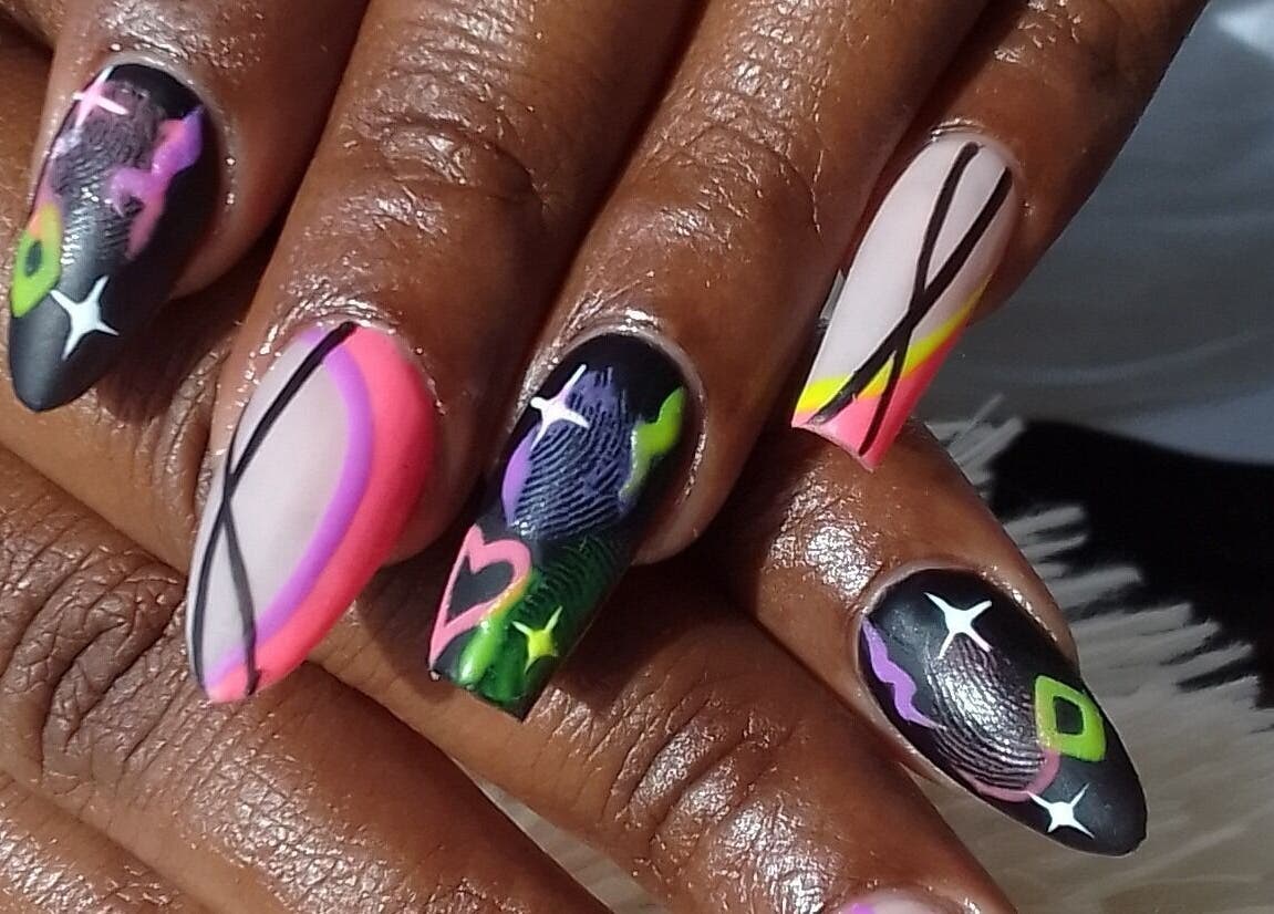 Colorful nail designs at The StLucian Goddess Nail Salon, Gros Islet, LC, showcasing creative artistry.