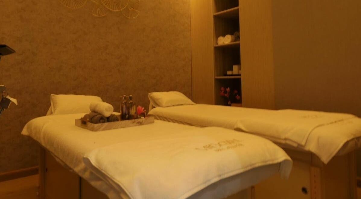 Luxurious massage room with twin beds at Midori Spa and Wellness, Dubai, AE, offering a calming ambiance.