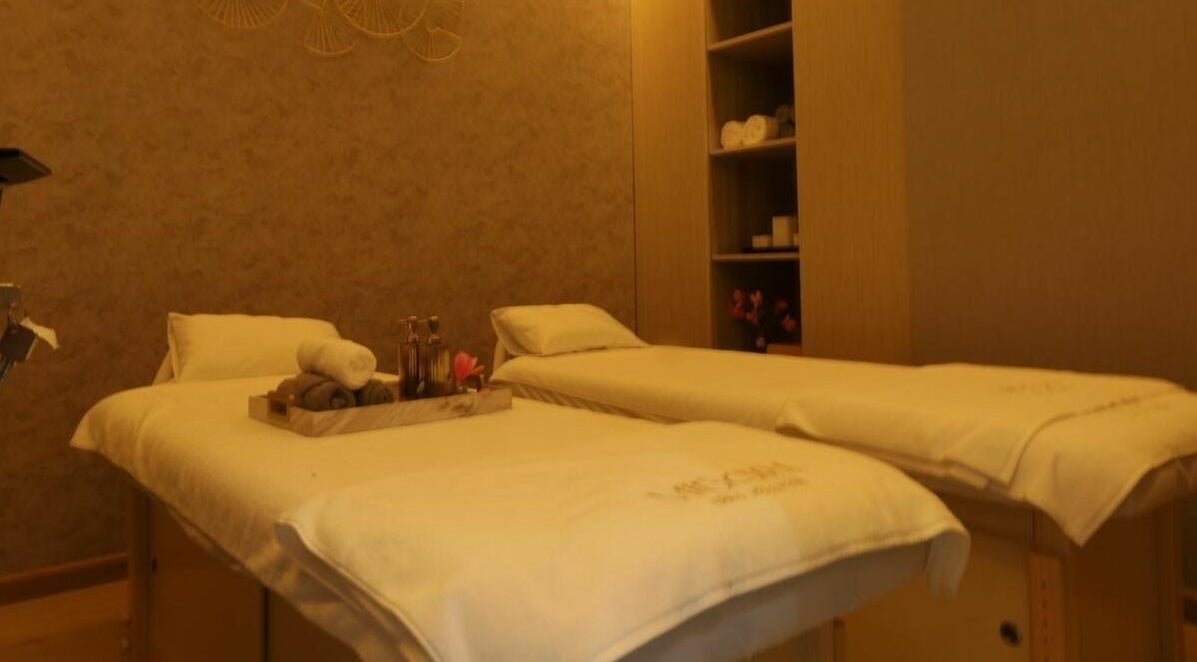 Luxurious massage room with twin beds at Midori Spa and Wellness, Dubai, AE, offering a calming ambiance.