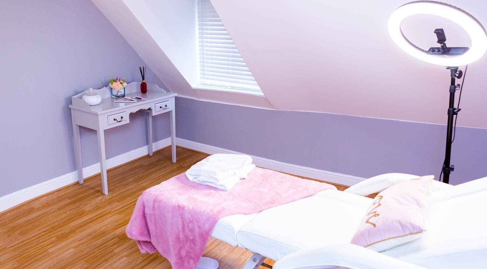 Calm treatment room at De Luxe Skin and Beauty Clinic in Maidstone, England, GB, with a plush pink blanket.