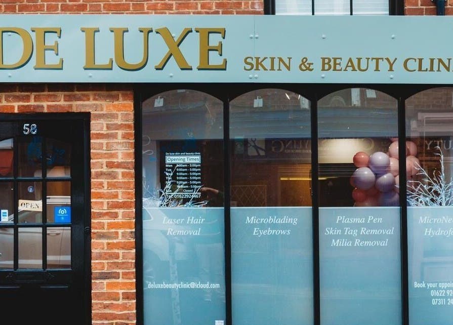 Entrance of De Luxe Skin and Beauty Clinic located in Maidstone, England, GB with stylish storefront signage.