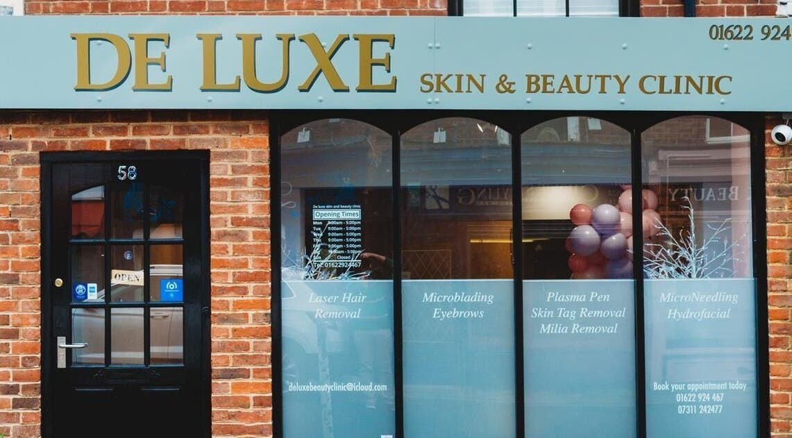 Entrance of De Luxe Skin and Beauty Clinic located in Maidstone, England, GB with stylish storefront signage.