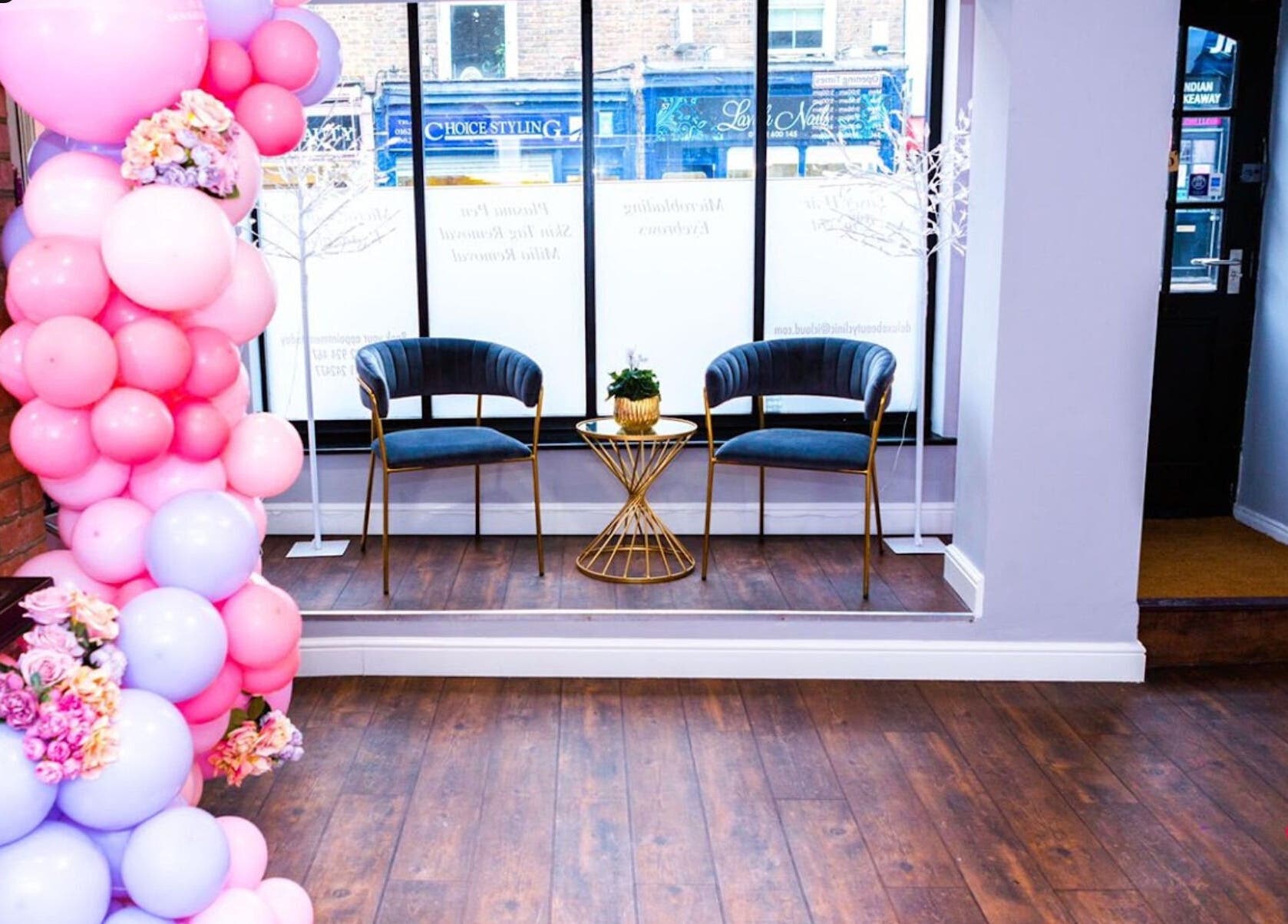 Elegant waiting area inside De Luxe Skin and Beauty Clinic, Maidstone, England, GB with chic seating and decor.