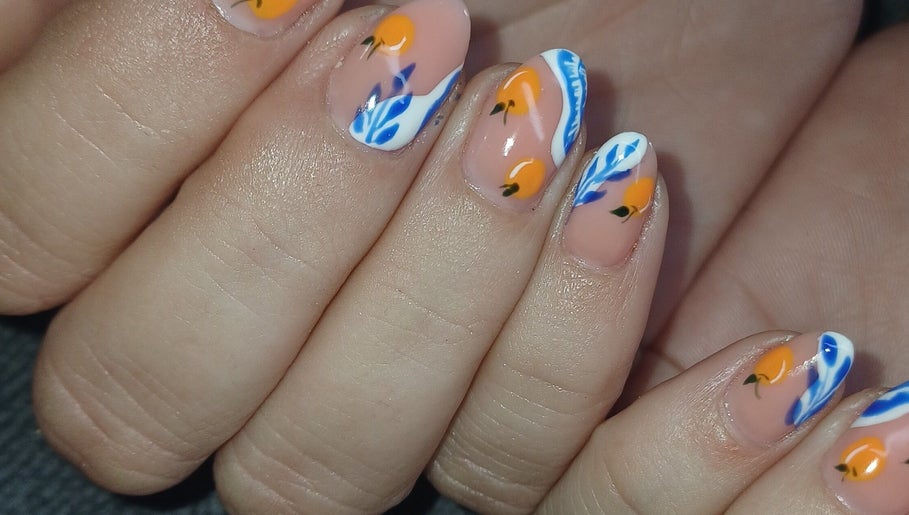 Vibrant citrus-themed nails at I CAN be nail bar, Kimberley, Northern Cape, ZA showcasing orange and blue designs.