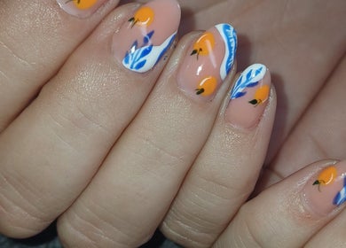 Vibrant citrus-themed nails at I CAN be nail bar, Kimberley, Northern Cape, ZA showcasing orange and blue designs.