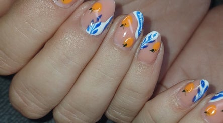 Vibrant citrus-themed nails at I CAN be nail bar, Kimberley, Northern Cape, ZA showcasing orange and blue designs.