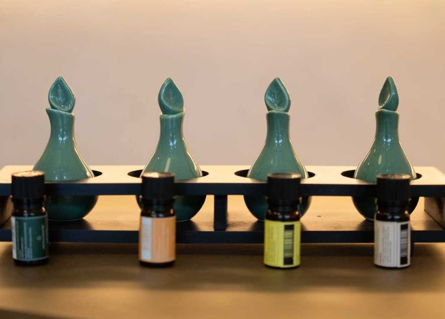 Elegant teal vases with oils at Ambience Wellness - Claremont, Claremont, Western Australia, AU.