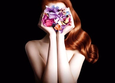 Elegant red hair with floral arrangement at Star Vision Hair Designer, Beirut, Beirut Governorate, LB.