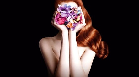 Elegant red hair with floral arrangement at Star Vision Hair Designer, Beirut, Beirut Governorate, LB.