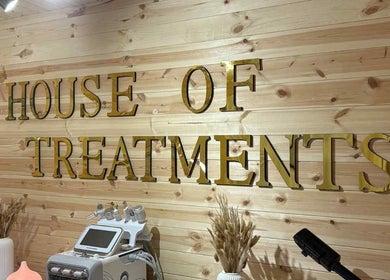 Elegant interior of House Of Treatments in Poole, England, GB featuring wooden decor and wellness equipment.