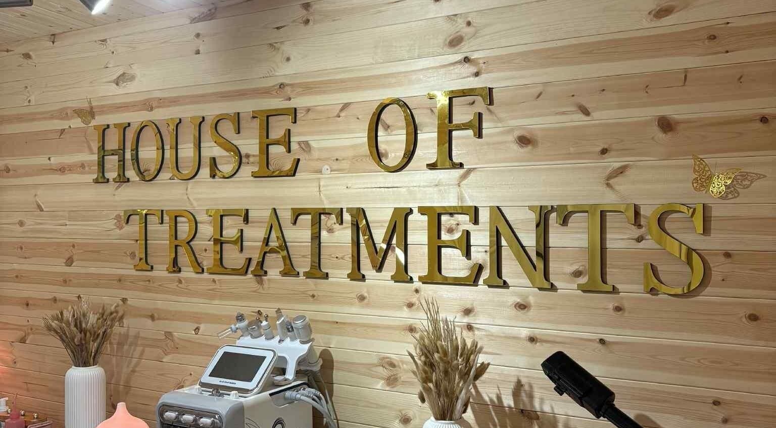 House Of Treatments interior with golden sign and equipment in Poole, England, GB.